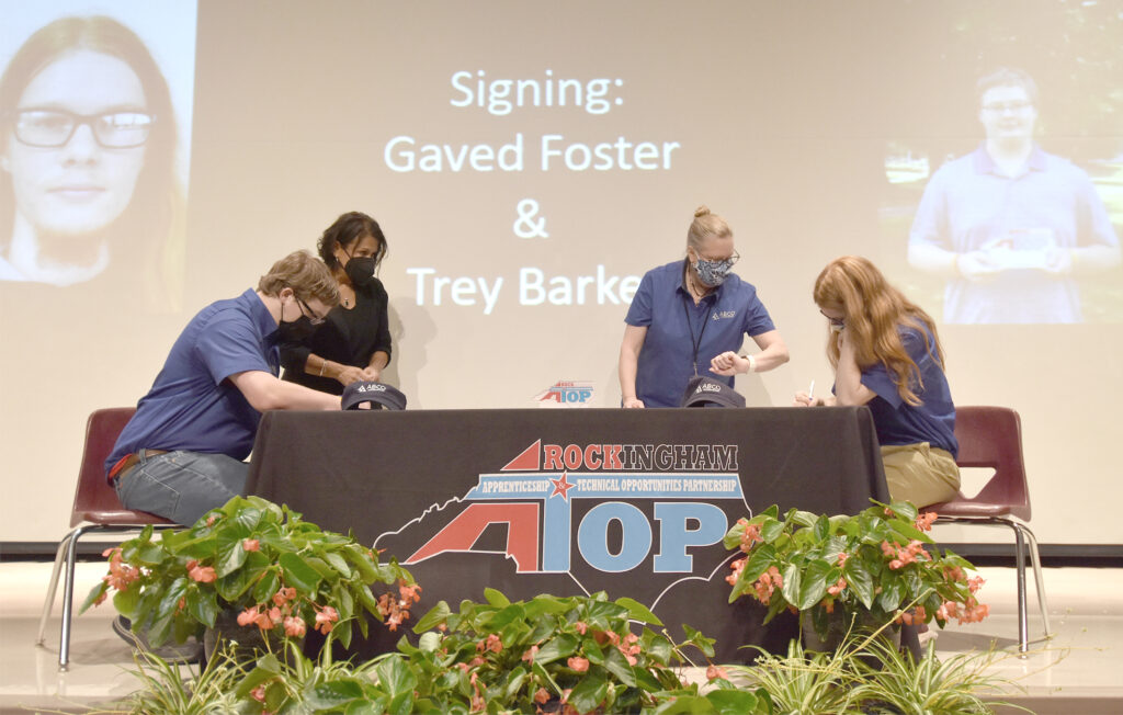 Apprentices sign RockATOP agreements.
