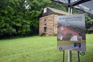 A sign showing the county quilt trail, with RCC's barn in the background