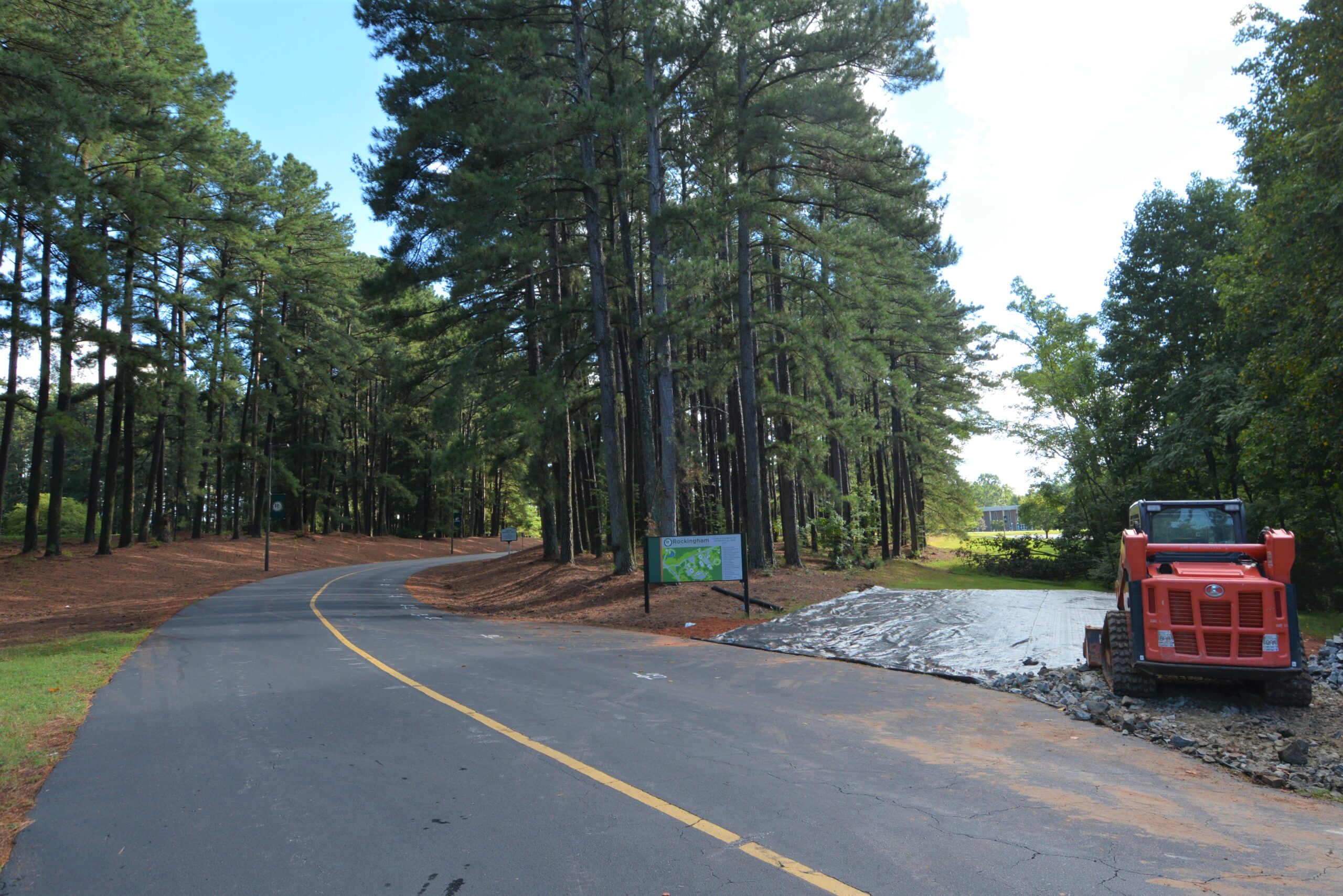 Work begins on the clearing from Wrenn Memorial Road toward the Science Center parking lot, 8/11/2022.