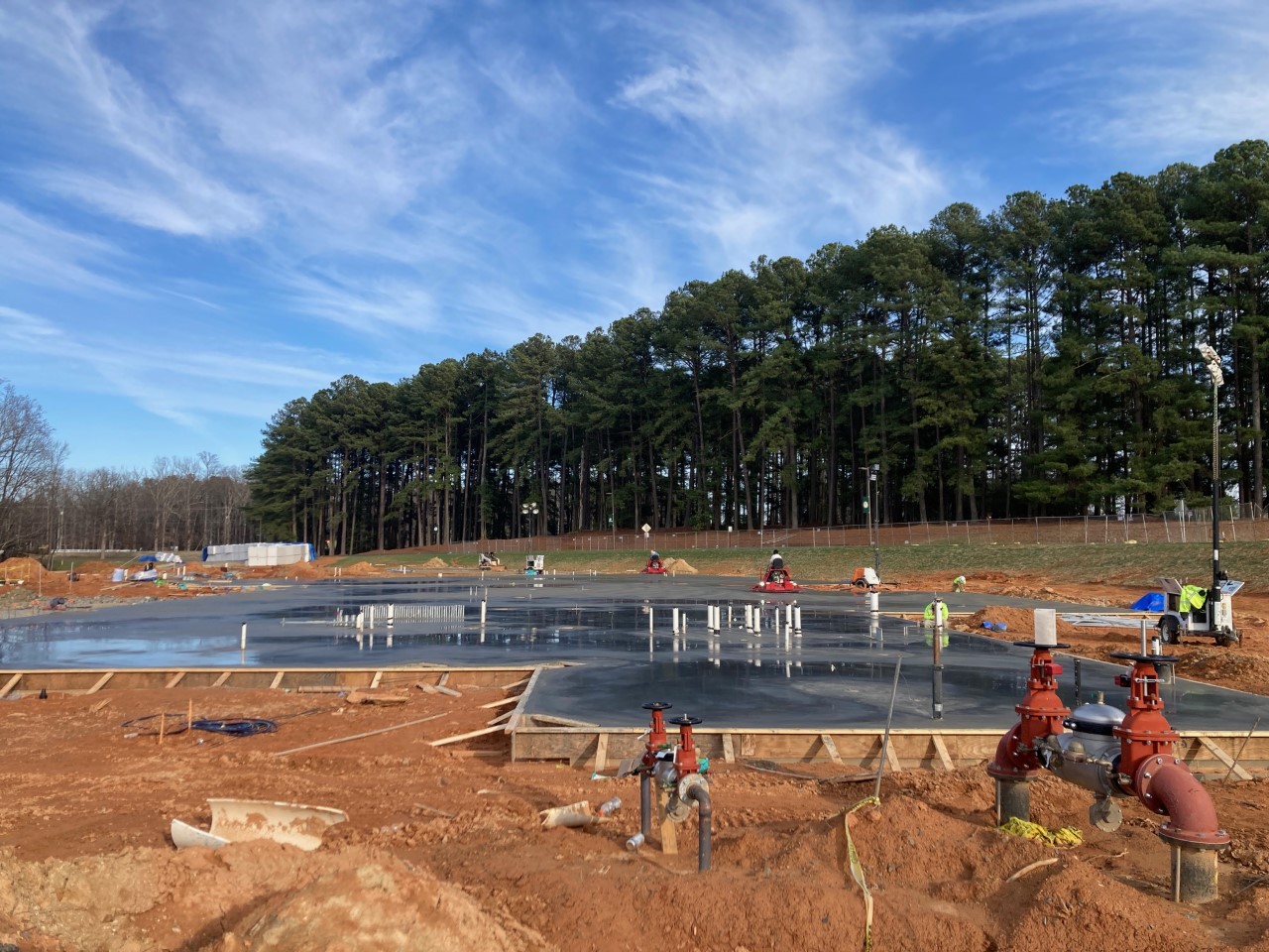 View of half of the concrete foundation slab poured, 1/21/2023.