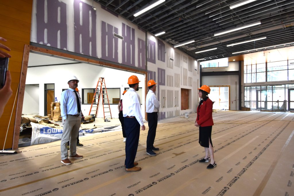 Group of people touring the lobby of a building under construction