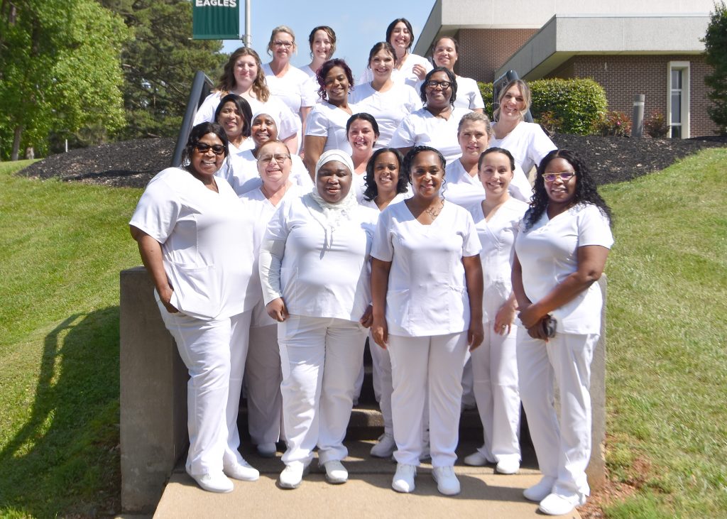 Licensed Practical Nursing to Associate Degree Nursing graduates pose for a photo